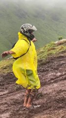 Friends Struggle to Ascend Muddy Off-road Trail in Rain in Kerala, India