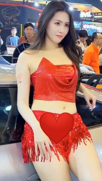 Stunning Beauty in a Short Red Dress | Mesmerizing Fashion and Style