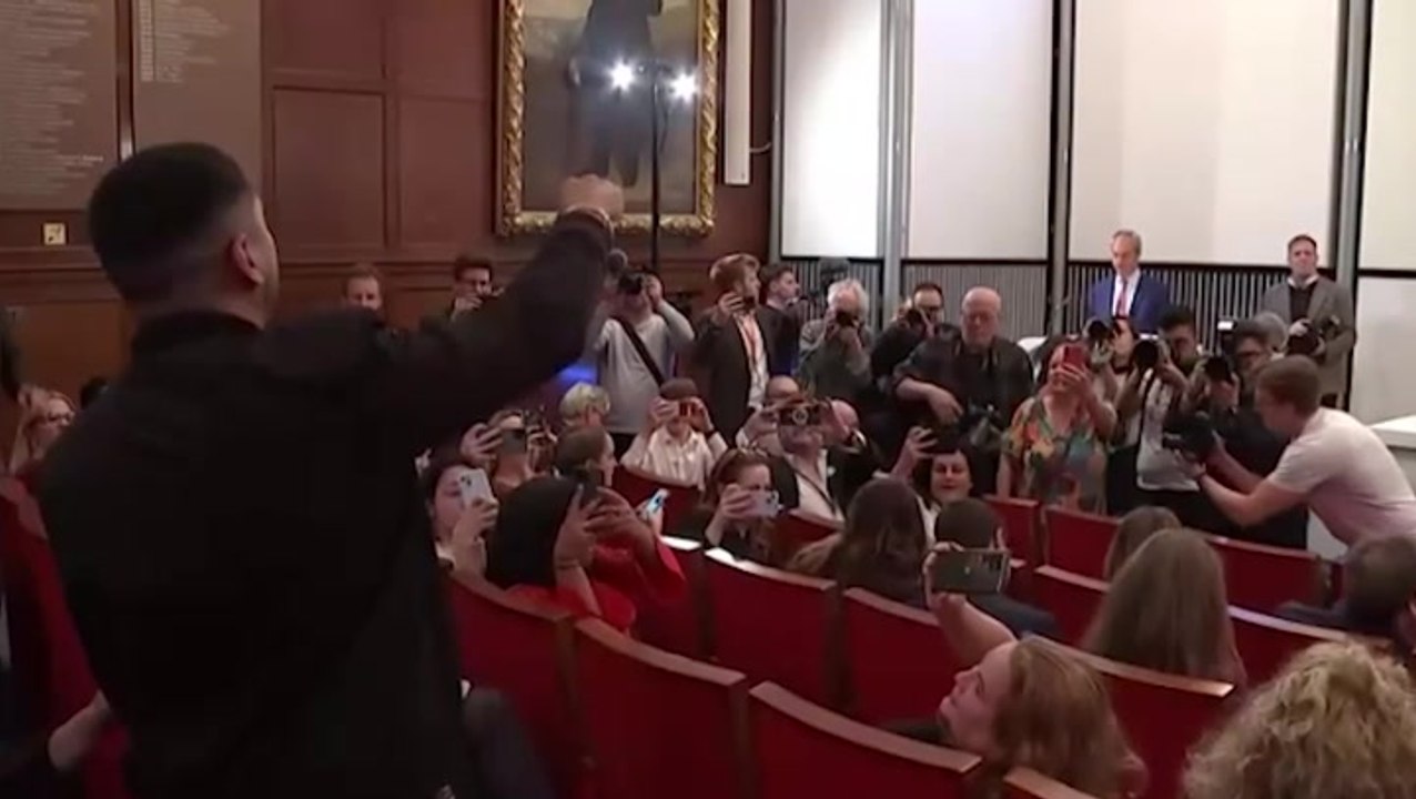 Nigel Farage heckled by several protesters during first speech as MP