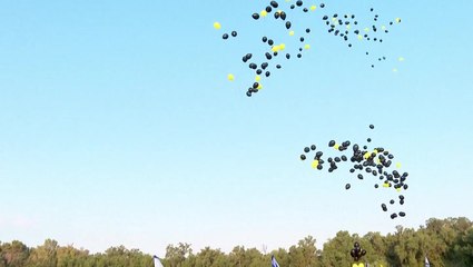 Protesters in Israel release thousands of balloons to mark nine months of war