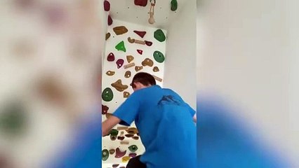 Dad transforms stairs into climbing wall so son can practice