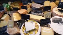 Cheesemonger Alex Hunt explains his love for cheese at his shop in Abbots Bromley.