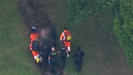 Triple murder suspect Kyle Clifford stretchered out of cemetery in Enfield