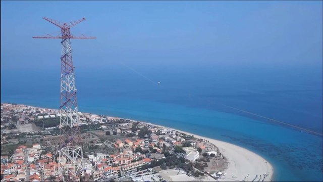 Estonian Jaan Roose walks the longest ever slackline between mainland Italy and Sicily