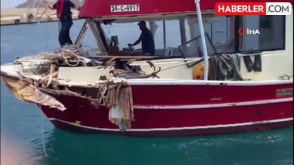 Yunan unsurlarının çarparak hasar verdiği balıkçı teknesi Kuzu Limanına çekildi