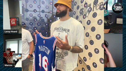 Caleb Martin holding a 76ers Jersey hurts Heat Fans