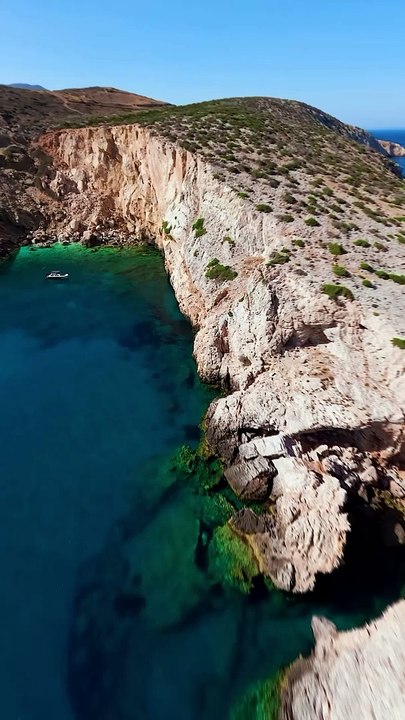 Rate the dive at the end --_You can_t miss this place if you visit Ios_ Greece__._Found this epic cliff jumping spot on my recent trip to Ios where the water looks like Powerade. The boat ride there was pretty wild due to the strong winds in(