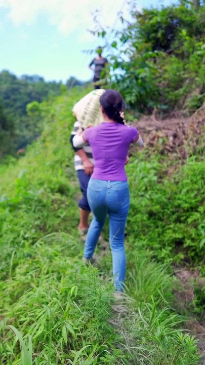 Elegant Girl Carrying Fertilizer: Helping Her Parents with Agriculture