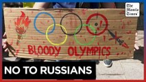 Ukrainians in France protest against Russian athletes taking part in Olympics