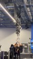 Tall Lighting Tower Bumps Into Ceiling Lights and Breaks It