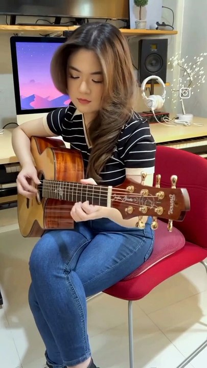 Cute playing guitar