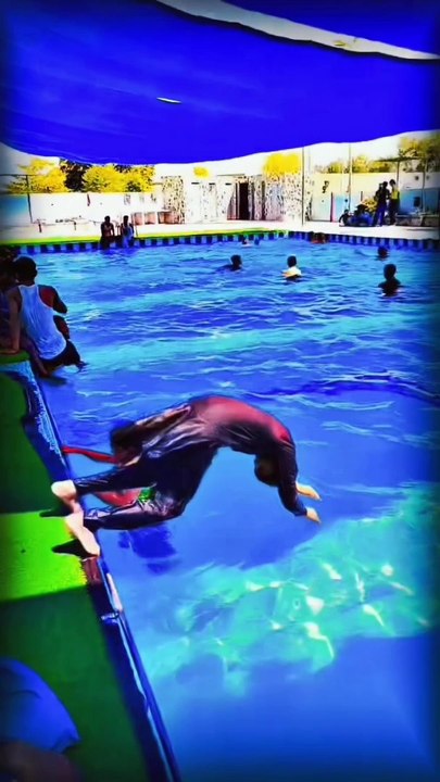 A child sweming at pool.