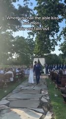 Veil Falls Off as Joyous Bride Accidentally Steps on it After Kissing Groom