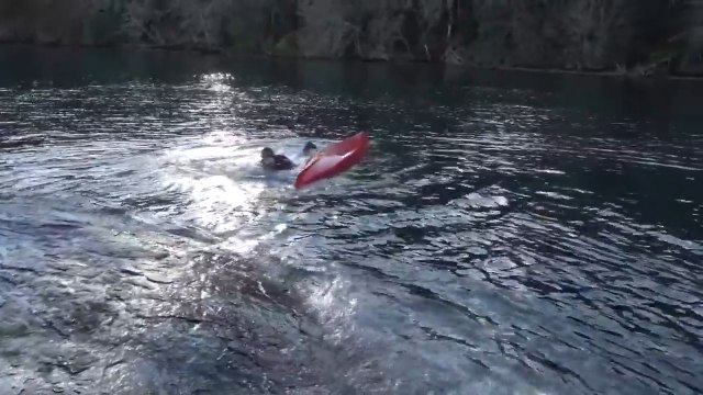 Guy Rolls Kayak Upside Down After Sliding Down Rock Into River