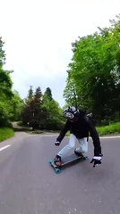 Man Skateboards on Road