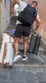 Retractable Suitcase Handle Breaks As Man Carries Luggage Up Stairs