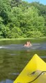 Girl Falls from Kayak While Trying to Stand on it