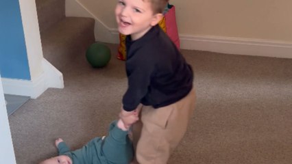 Adorable playtime: Elder brother treats the baby sister like his favorite toy