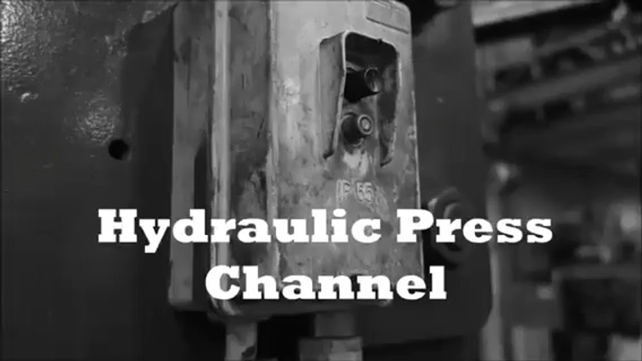 Crushing mobile phone with hydraulic press