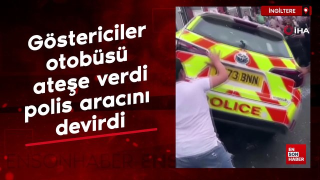 İngiltere’de göstericiler otobüsü ateşe verdi, polis aracını devirdi