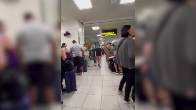Huge queues snake though Gatwick airport as global IT outage disrupts flights