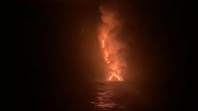 Erupting Stromboli & mesmerizing lava flow combat the sheer darkness of the night