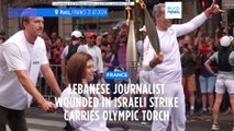 Wounded photojournalist carries Olympic flame in Paris