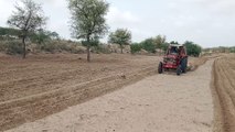 Tractor ploughing field of Thar desert | Thar after rain