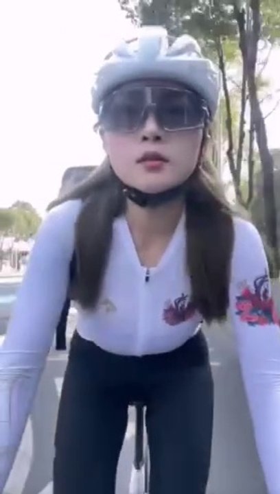 The Chinese girl rides a great bicycle