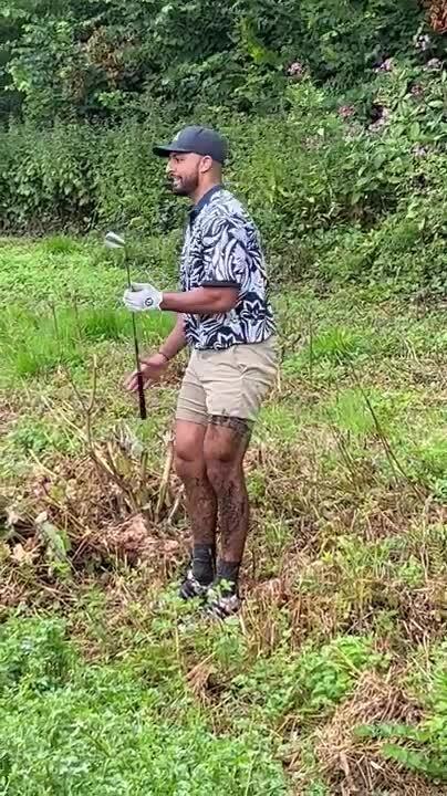 Golfer Hilariously Falls Into Muddy Ditch While Attempting to Cross it