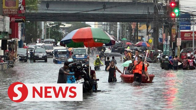 Heavy rains from Typhoon Gaemi render Manila streets underwater