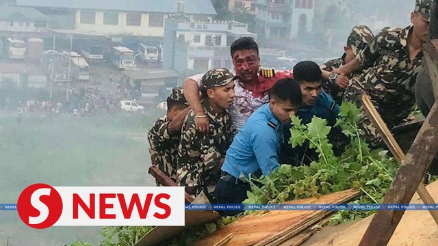 Pilot, sole survivor of deadly plane crash in Nepal, pulled from wreckage