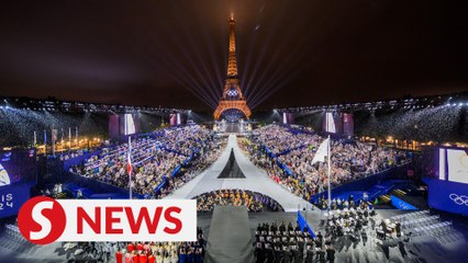 Rain won't spoil the party, Olympic fans call opening ceremony 'out of this world'