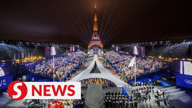 Rain won't spoil the party, Olympic fans call opening ceremony 'out of this world'