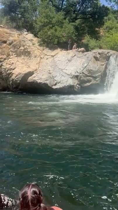 Boy Falls Awkwardly in Water While Cliff Jumping