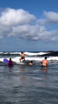 Girl Accidentally Hits Boy With Surfboard on First Surfing Lesson