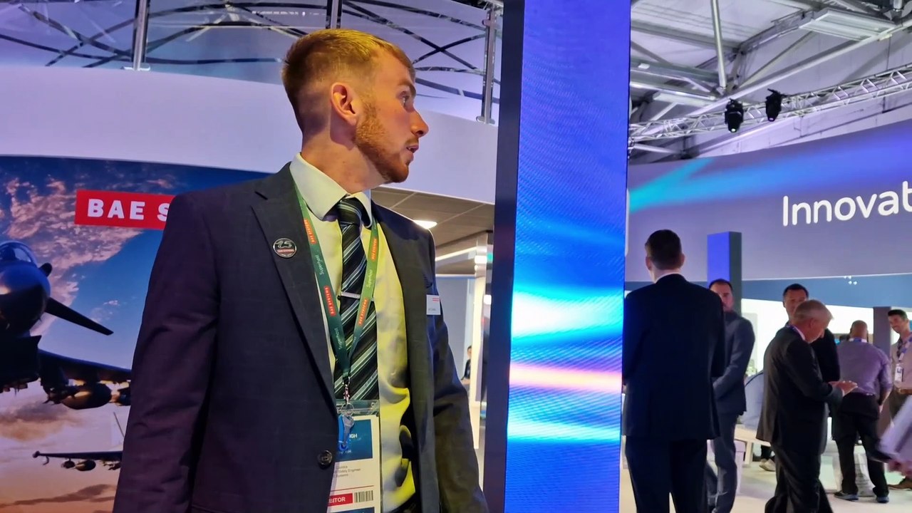 BAE Systems take visitors on a tour around their exhibition hangar at the Farnborough Air Show