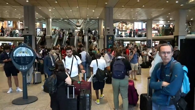 Crowds gather at Paris train stations as travel chaos unfolds ahead of Olympics