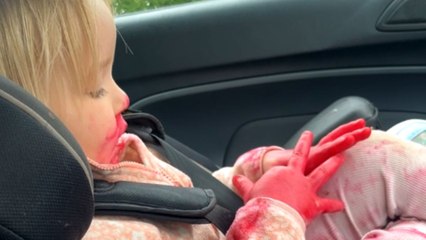 Unexpected mess: Mom catches the toddler's lipstick exploration on the drive