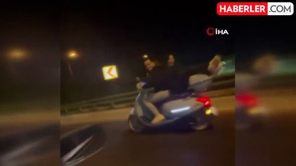 Motosikletin arkasında yatarak ilerledi