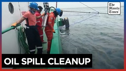 Philippine Coast Guard clean up after oil tanker sinks