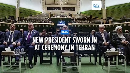 Iran's new president sworn in, pledges to fight economic sanctions