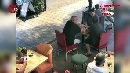 Kafede otururken yorgun mermi omzuna isabet etti  o anlar kamerada