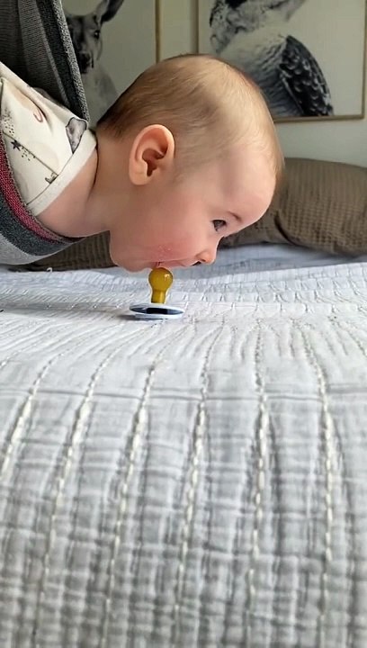 Baby playing with nipple