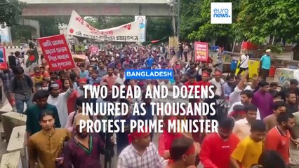 Two dead and dozens injured as thousands protest against prime minister in Bangladesh