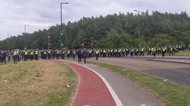 Police corral over 700 anti-immigration protestors from scene of riot at Rotherham hotel