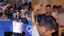 Tennis - Paris 2024 - Novak Djokovic celebrating his Olympic gold medal with the entire Serbian team!