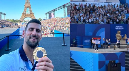 Tennis - Paris 2024 - Novak Djokovic cheered by the crowd at Champions Park after his gold medal