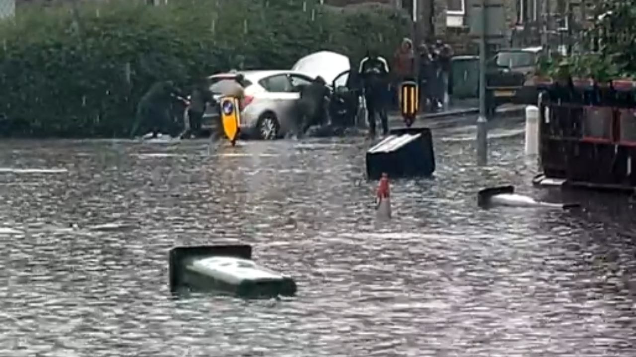 From warm sunshine to flooding: Unpredictable British storm hits town unexpectedly