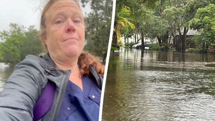 Nurse forced to walk through chest-height water left behind by Hurricane Debby